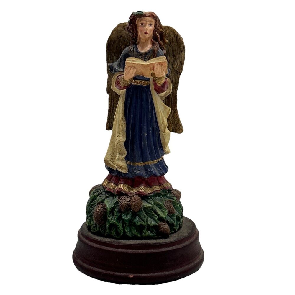 Vintage 4 3/4” angel figurine with‎ a open book